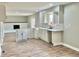 Renovated kitchen featuring white cabinets, subway tile, and hardwood floors at 5619 Pappas Dr, Indianapolis, IN 46237