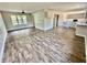 Open living room and kitchen with hardwood floors at 5619 Pappas Dr, Indianapolis, IN 46237