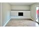 Living room with fireplace and hardwood floors and sliding glass doors at 5619 Pappas Dr, Indianapolis, IN 46237