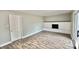 Living room with fireplace, hardwood floors and sliding glass doors at 5619 Pappas Dr, Indianapolis, IN 46237