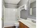 Clean bathroom with tub, shower, and wood vanity at 6350 W Chelmsford Dr, McCordsville, IN 46055