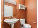 Simple bathroom with pedestal sink and white toilet at 6350 W Chelmsford Dr, McCordsville, IN 46055