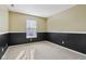 Bright bedroom with neutral walls and carpet at 6350 W Chelmsford Dr, McCordsville, IN 46055