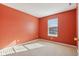 Spacious bedroom with orange walls and carpet flooring at 6350 W Chelmsford Dr, McCordsville, IN 46055