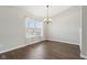 Dining room with hardwood floors and a chandelier at 6350 W Chelmsford Dr, McCordsville, IN 46055