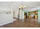 Open dining room with kitchen views and hardwood floors at 6350 W Chelmsford Dr, McCordsville, IN 46055