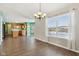 Open dining room with kitchen views and hardwood floors at 6350 W Chelmsford Dr, McCordsville, IN 46055