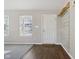 Front entry with white door and a rustic wood accent wall at 6350 W Chelmsford Dr, McCordsville, IN 46055