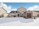 Two story house exterior with snow covered backyard at 6350 W Chelmsford Dr, McCordsville, IN 46055