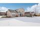 Two story house exterior with snow covered backyard at 6350 W Chelmsford Dr, McCordsville, IN 46055