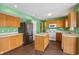 Kitchen with wood cabinets, stainless steel appliances, and island at 6350 W Chelmsford Dr, McCordsville, IN 46055