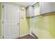 Laundry room with upper cabinets and space for washer/dryer at 6350 W Chelmsford Dr, McCordsville, IN 46055