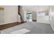 Open living area with hardwood floors and gray carpet at 6350 W Chelmsford Dr, McCordsville, IN 46055