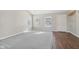 Bright living room with hardwood floors and gray carpet at 6350 W Chelmsford Dr, McCordsville, IN 46055