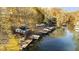 Stunning autumn view of lakefront homes and docks at 7018 Drum Dr, Nineveh, IN 46164