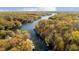 Aerial view of lakefront property with fall foliage at 7018 Drum Dr, Nineveh, IN 46164