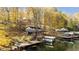 Lakeside home with private dock and boat slip in autumn setting at 7018 Drum Dr, Nineveh, IN 46164