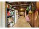 Unfinished basement with storage shelving and a refrigerator at 7018 Drum Dr, Nineveh, IN 46164