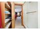 Bathroom with a shower, linen closet, and view of living area at 7018 Drum Dr, Nineveh, IN 46164