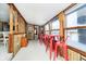 Casual dining area with red metal stools and a view of the lake at 7018 Drum Dr, Nineveh, IN 46164