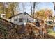 Stone house with deck overlooking lake; fall foliage at 7018 Drum Dr, Nineveh, IN 46164