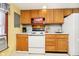Bright kitchen with wood cabinets, white appliances, and a charming country feel at 7018 Drum Dr, Nineveh, IN 46164