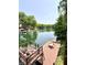 Scenic lake view with a large wooden dock, seating area, and clear water perfect for recreation at 7018 Drum Dr, Nineveh, IN 46164