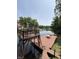 Scenic lake view with a large wooden dock, seating area, and clear water perfect for recreation at 7018 Drum Dr, Nineveh, IN 46164