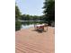 Relax on this large wooden dock featuring outdoor seating with lake views, ideal for entertaining at 7018 Drum Dr, Nineveh, IN 46164