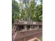Unique multi-level deck home nestled in a lush wooded area offering ample outdoor living space at 7018 Drum Dr, Nineveh, IN 46164