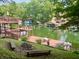 Stunning lake views featuring multi-level decks, docks, and lush green surroundings, perfect for entertaining at 7018 Drum Dr, Nineveh, IN 46164