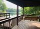 Inviting porch with swing overlooking the serene lake, perfect for relaxing and enjoying the view at 7018 Drum Dr, Nineveh, IN 46164