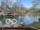Beautiful lakefront scene with boat docks, lush greenery, and charming homes nestled along the tranquil shoreline at 7018 Drum Dr, Nineveh, IN 46164