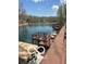 Waterfront property with private dock and pier offers direct access to the serene lake for boating and recreation at 7018 Drum Dr, Nineveh, IN 46164