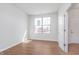 Inviting bedroom with light wood floors, a bright window, and a fresh, neutral paint scheme at 7164 Firestone Rd, Whitestown, IN 46052