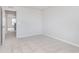 Bedroom with neutral carpet, light gray walls, and a doorway to the hall at 7164 Firestone Rd, Whitestown, IN 46052