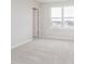 Bedroom featuring neutral carpet, light gray walls, and a large window offering neighborhood views at 7164 Firestone Rd, Whitestown, IN 46052