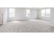 Living room featuring natural lighting and carpeted floors at 7164 Firestone Rd, Whitestown, IN 46052