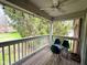 Cozy balcony with overhead fan and furnishings, ideal for relaxing and enjoying the scenery at 8104 Glenwillow Ln # 208, Indianapolis, IN 46278