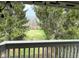 Second balcony view looking out over the common area and featuring mature trees at 8104 Glenwillow Ln # 208, Indianapolis, IN 46278