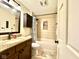 Updated bathroom with granite vanity, tile shower/tub combo at 8104 Glenwillow Ln # 208, Indianapolis, IN 46278