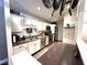 Updated kitchen with stainless steel appliances and granite countertops at 8104 Glenwillow Ln # 208, Indianapolis, IN 46278