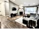 Spacious living room with fireplace and L-shaped sectional sofa at 8104 Glenwillow Ln # 208, Indianapolis, IN 46278