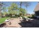 Inviting backyard patio with stone pavers, seating, and a built-in fire pit for cozy outdoor gatherings at 10295 Summerlin Way, Fishers, IN 46037