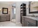 Primary bathroom with double vanity, granite countertop, and a walk-in shower at 10295 Summerlin Way, Fishers, IN 46037
