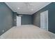 Large bedroom featuring neutral walls, carpeting, and ceiling fan at 10295 Summerlin Way, Fishers, IN 46037