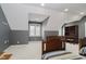 Bright bedroom with two twin beds, built-in shelves, and a window at 10295 Summerlin Way, Fishers, IN 46037