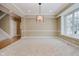 Spacious dining room with large windows and neutral decor at 10295 Summerlin Way, Fishers, IN 46037