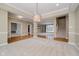 Open concept dining room with hardwood floors and access to kitchen at 10295 Summerlin Way, Fishers, IN 46037