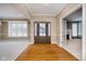 Bright and spacious entryway with hardwood floors and views to other rooms at 10295 Summerlin Way, Fishers, IN 46037